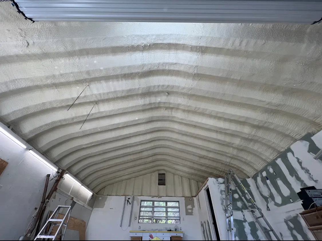 Spray polyurethane foam applied to the underside of a metal roof deck in Blue Island